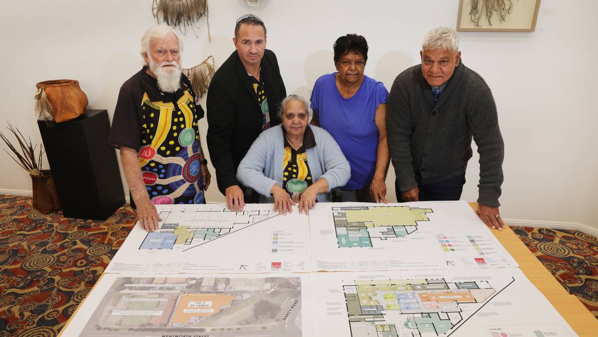 James Carlson, William Henry, Irene Moran, Dawn Bell and Richard Davis look over plans for the former leagues club. Picture by Sylvia Liber
