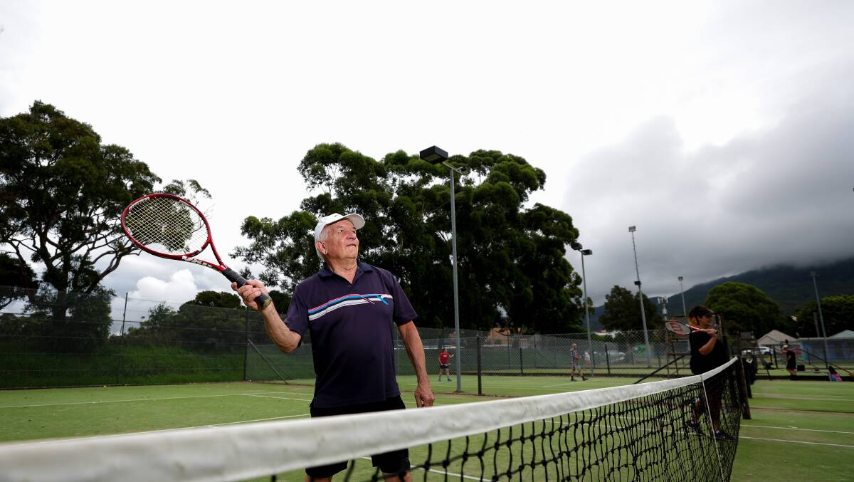 John Gill, president of the Wollongong 40+ Get Out and Have Fun Club Inc plays tennis at the Corrimal Tennis Courts. Picture by Adam McLean