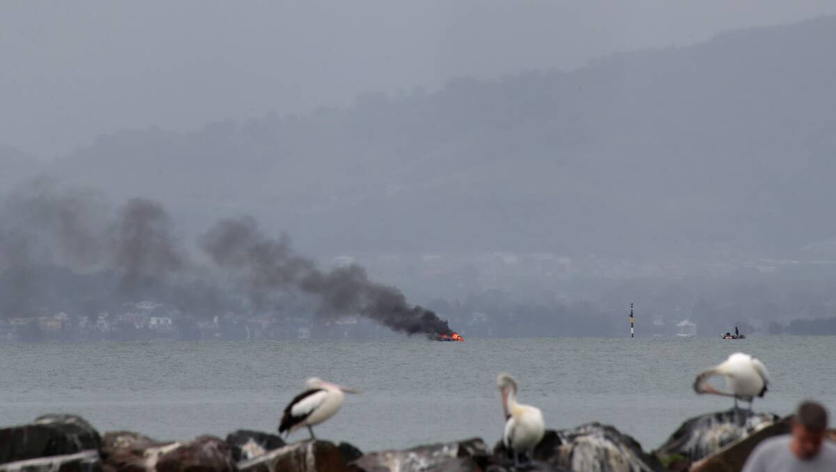 Five Fire and Rescue NSW trucks raced to the lake after they were alerted to smoke billowing from a boat blaze about 2km offshore from Berkeley.
. Picture by Sylvia Liber.