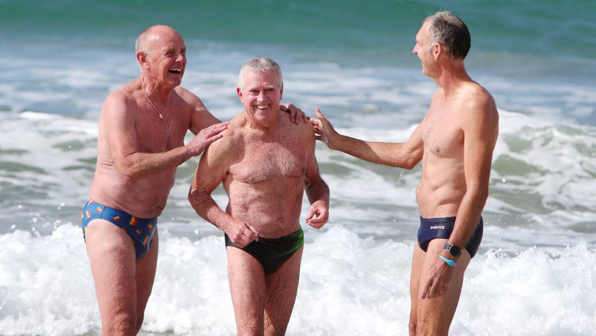 Silver Salties members Allan Hutton, 70, Lloyd Jones, 82, and Ian Sakoff, 55, at Thirroul Beach. Picture by Sylbia Liber