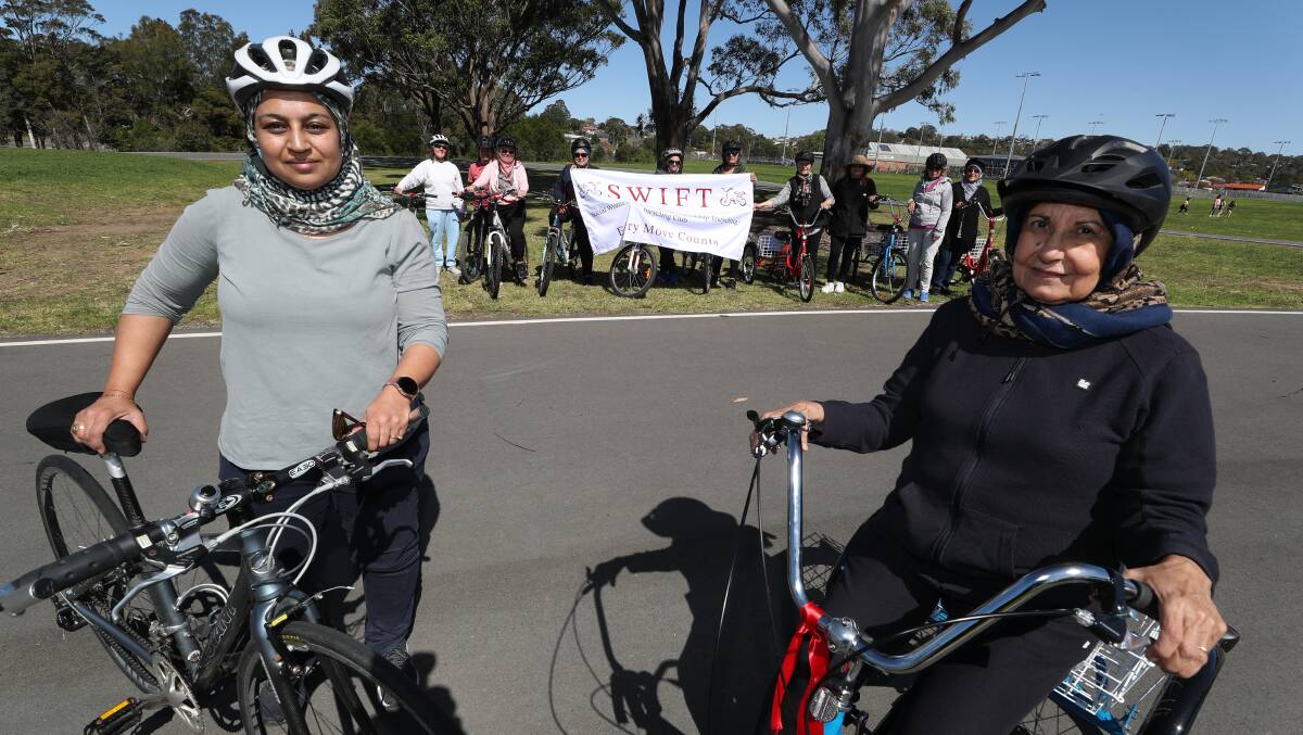 SWIFT Chairperson Dr Farhannah Aly with mother-in-law Shabniz Aly, with the social cycling group in the background. Picture by Robert Peet