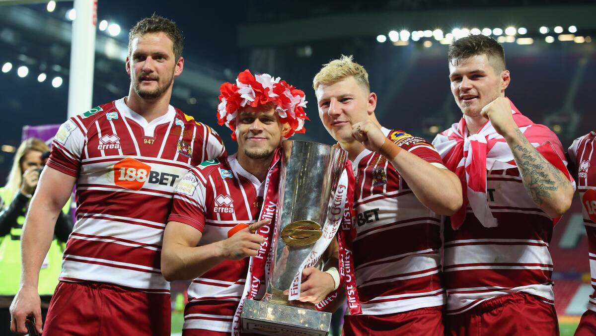 Sean O'Loughlin, Lewis Tierney, George Williams and John Bateman of Wigan Warriors celebrate victory in the First Utility Super League Final in 2016. Picture: GETTY IMAGES