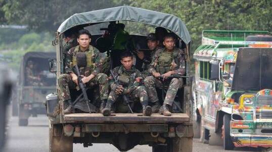Soldiers ride a military vehicle on the outskirts of Marawi city, southern Philippines, earlier this month. Photo: AP