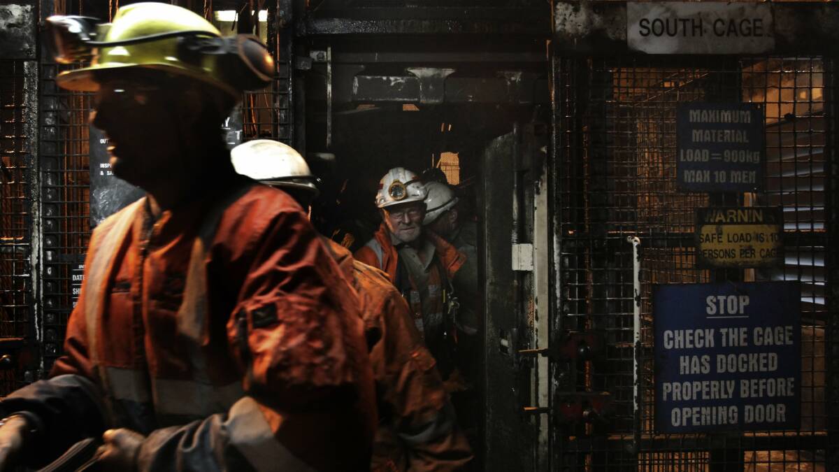 Job security: Inside the Metropolitan mine, the cage takes workers down towards the coal face