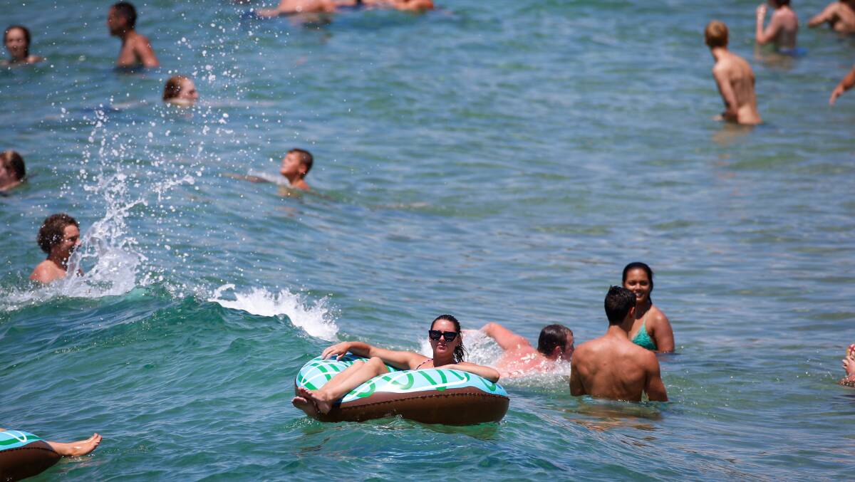 People cool off at City Beach in Wollongong. Picture: ADAM McLEAN