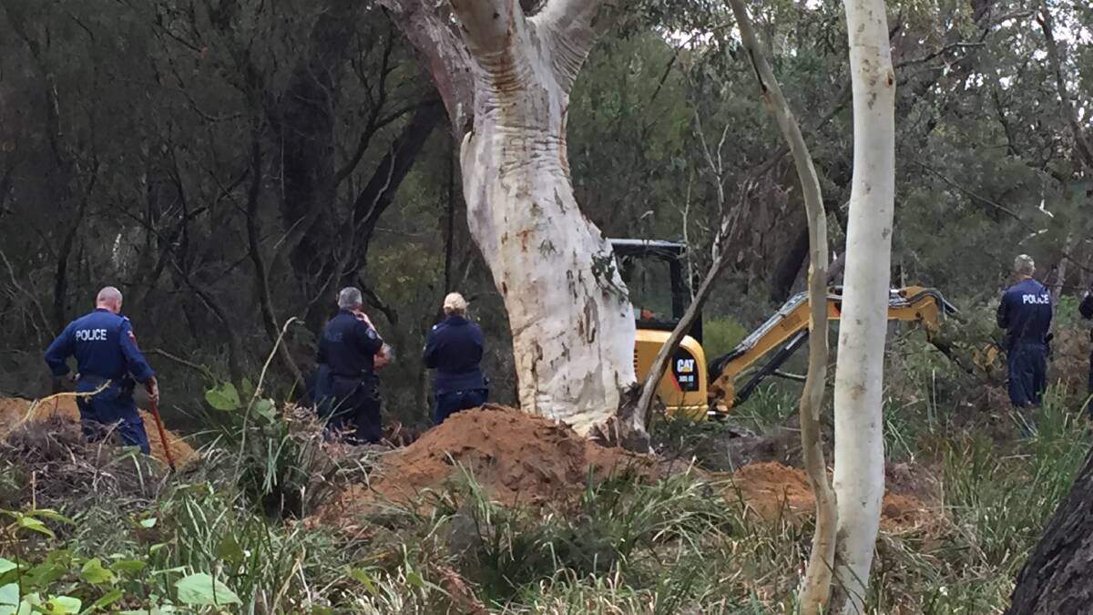 Police search bushland at Cataract on Monday morning for the body of missing schoolgirl Quanne Die. Picture: ADAM McLEAN