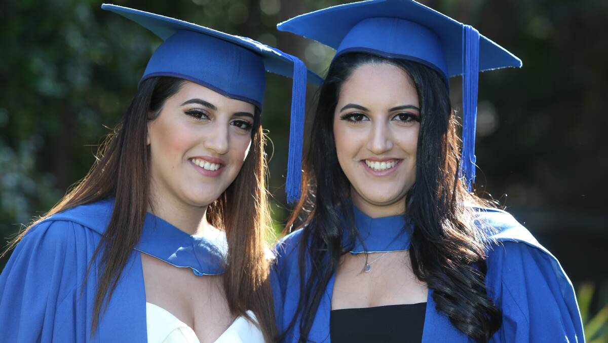 Rochelle Hallasso and Michelle Hallasso at the UOW graduation ceremony on Tuesday. Picture: ROBERT PEET