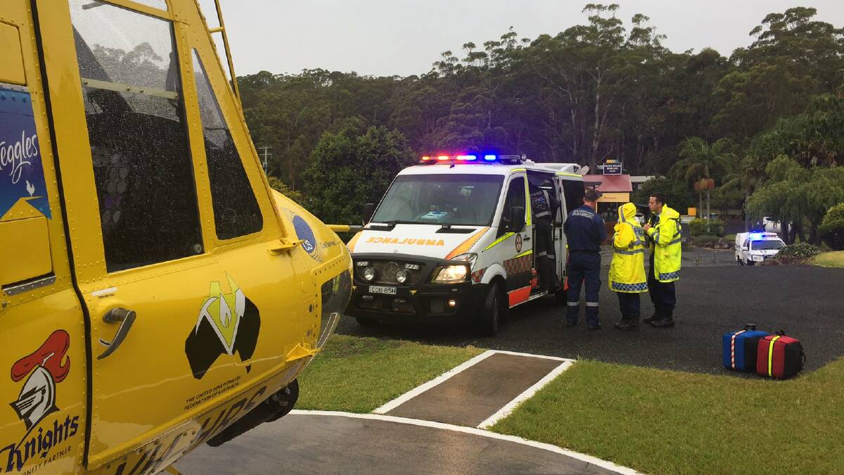 Police and paramedics at the scene of a shark attack at Booti Booti, on the NSW Mid North Coast.