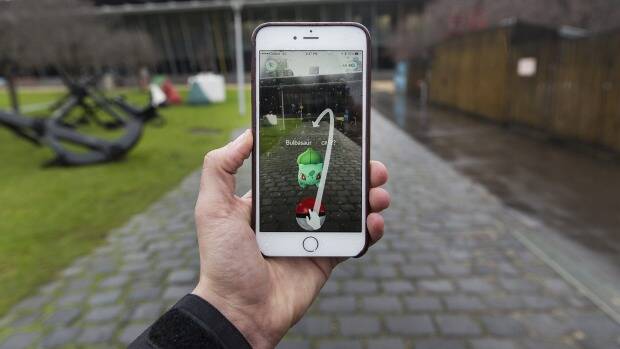 Pokemon GO has become the most popular mobile game almost literally overnight. Photo: Paul Jeffers
