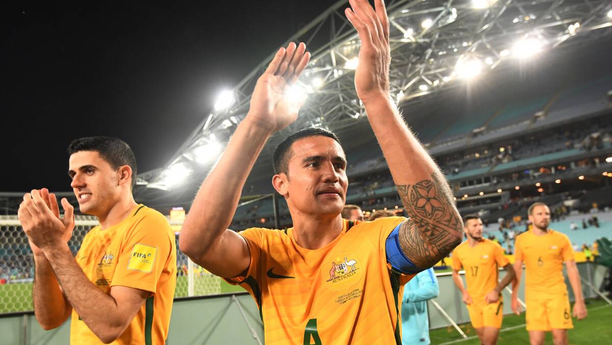 Australia's Tim Cahill (centre) and Tomas Rogic (left). Picture: AAP
