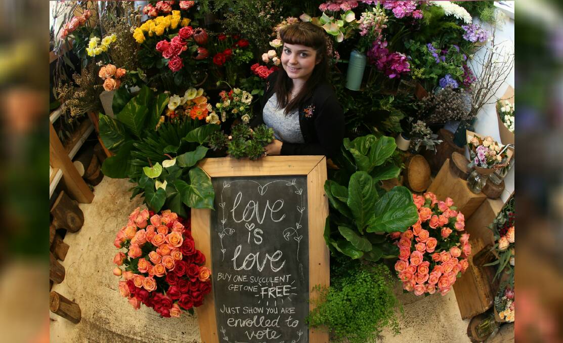 LOVE IS LOVE: Wollongong florist Anita Brown from Pepe's Garden is encouraging people to register for the marriage equality postal vote. Anyone who shows they have registered will get a free succulent. Picture: Robert Peet