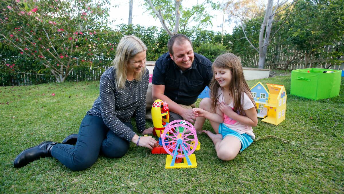 Martin Schmidt with daughter Chloe and wife Karina Schmidt. Chloe's mood and behaviour dramatically changed when she started taking Montelukast. Picture: ADAM McLEAN