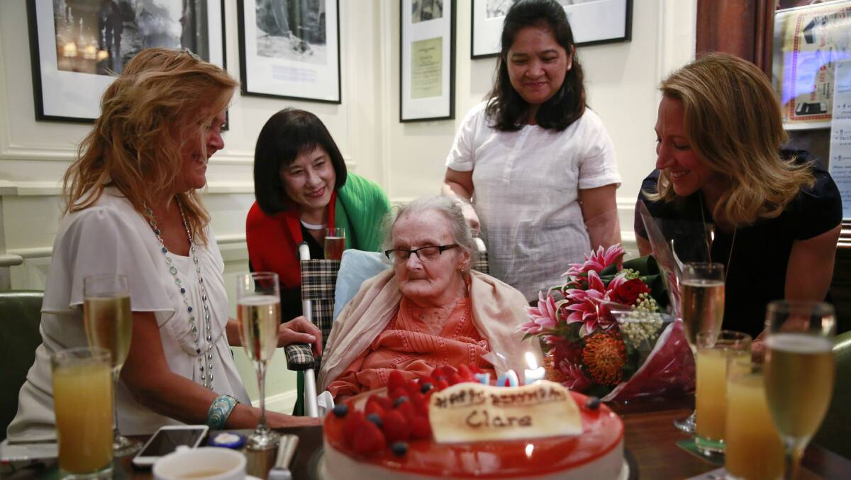 Clare Hollingworth, center, a British former longtime foreign correspondent, is surrounded by friends and admirers at her birthday party at Hong Kong's Foreign Correspondents' Club. Photo: AP