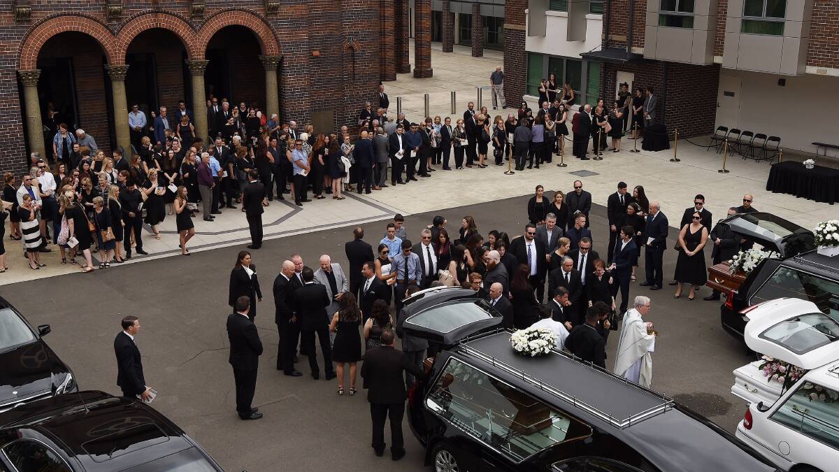The crowd gathers outside the church after the funeral of Annabelle Falkholt and her parents Lars and Vivian Falkholt at St Mary's Catholic Church, Concord. Picture: Kate Geraghty