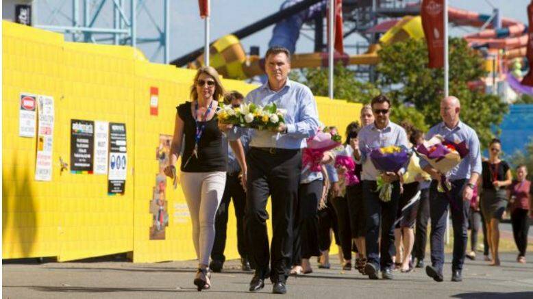 Dreamworld CEO Craig Davidson and his employers laid flowers at the scene on Wednesday. Photo: Glenn Hunt