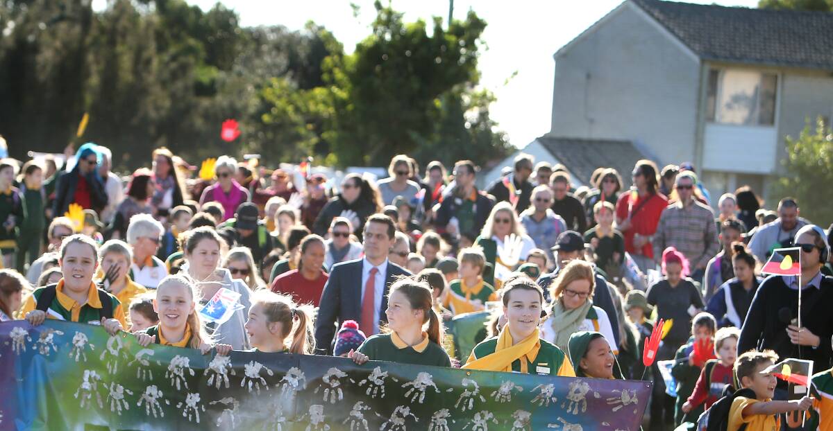 Get walking: Students of Bellambi Public School lead the Reconciliation Walk marking the beginning of Reconciliation Week. Picture: Sylvia Liber