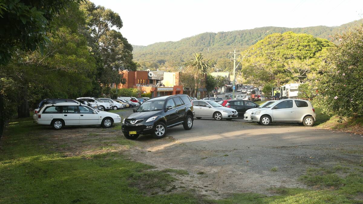 Wollongong City Council plans to pave this unofficial car park - originally due for completion this month - has been delayed.