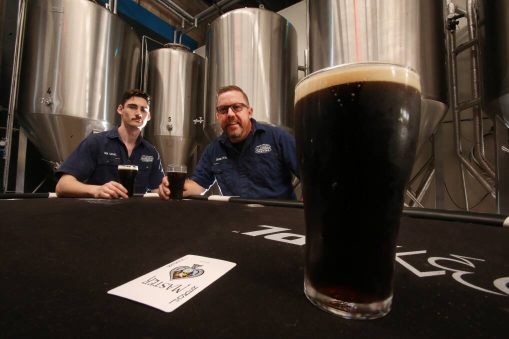 The Illawarra Brewing Company's Tim Howard and Dave McGrath sample the new smoked jalapeno porter. Picture: Robert Peet