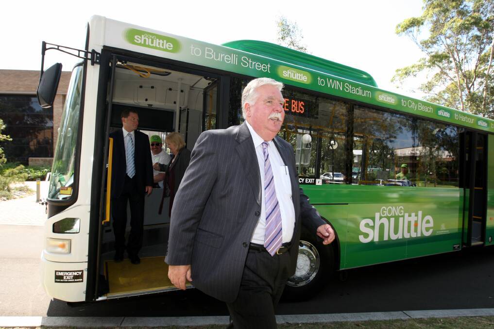 Founding father: David Campbell - with former Premier Nathan Rees and Wollongong MP Noreen Hay at rear - gets off the first Gong Shuttle back in March 2009. Picture: Sylvia Liber