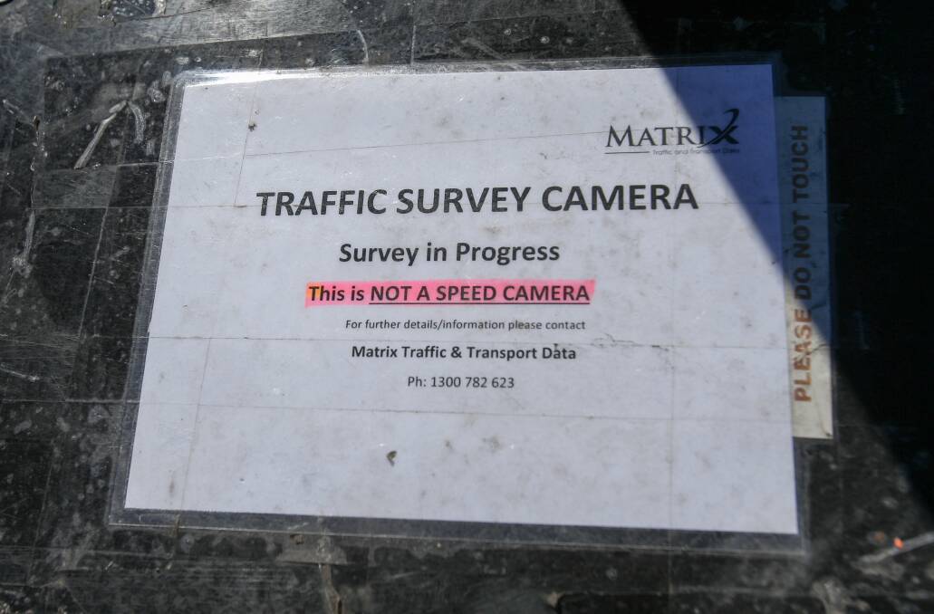 The notice on the outside of the survey cameras.