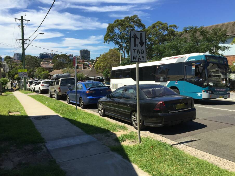 Parking problem: A car parked in a no stopping zone during the afternoon pick-up at Wollongong Public School. Readers said this sort of thing happens at a number of schools in the region.