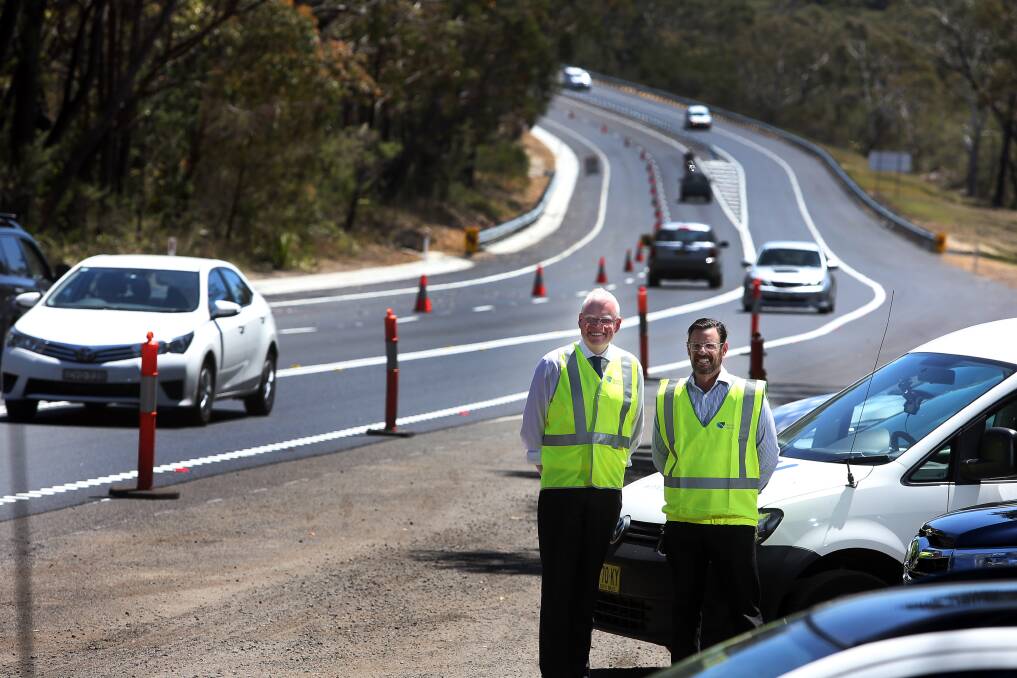 Kiama MP Gareth Ward and Roads and Maritime Services' Julian Watson at the new stretch of Appin Road. Picture: Robert Peet