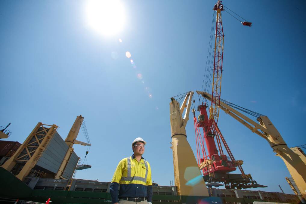 Patrick eastern regional manager Bob Shueh with Big Red, the crane that will load up ships with BlueScope steel. Picture: Adam McLean