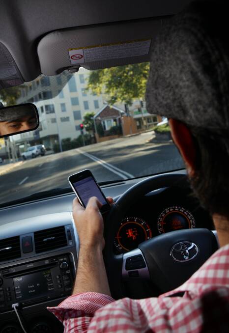 Using a phone while driving over the next few days will cost you eight demerit points with double demerits in place through to the end of Australia Day.