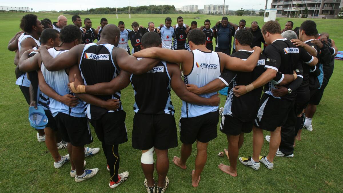The Fiji rugby league team joined in a prayer circle after training at WIN Stadium before a 2008 World Cup match. The team included Port Kembla Blacks captain-coach James Storer. Picture: Robert Peet