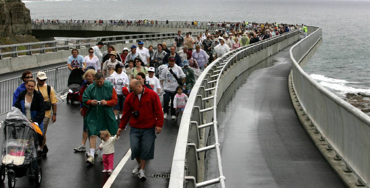 opening day: Contest winners walk across the Sea Cliff Bridge in 2005. Picture: Orlando Chiodo
