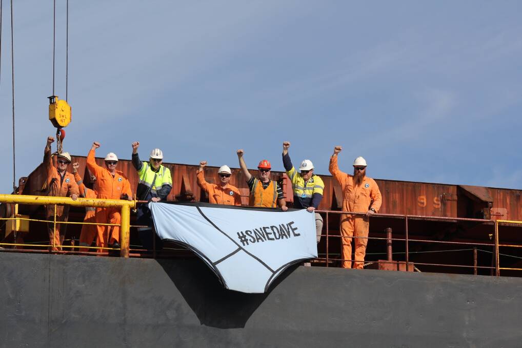 Members of the MUA at Port Kembla show their support for sacked miner Dave McLachlan (in the orange helmet) with a large pair of protest undies.