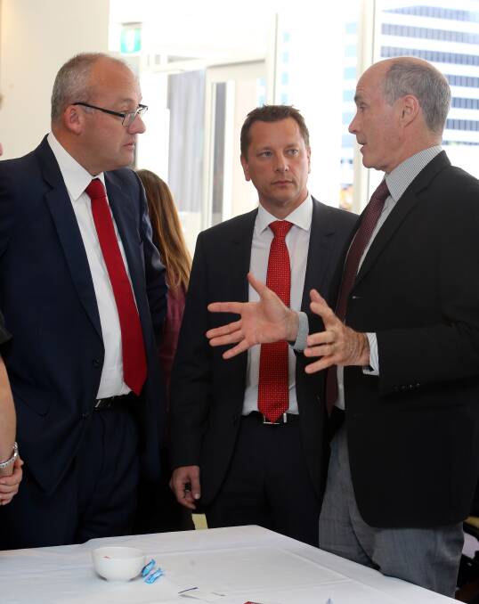 meet and greet: Labor leader Luke Foley and Wollongong candidate Paul Scully talk with UOW Professor Chris Cook at Monday's community cabinet. Picture: Robert Peet