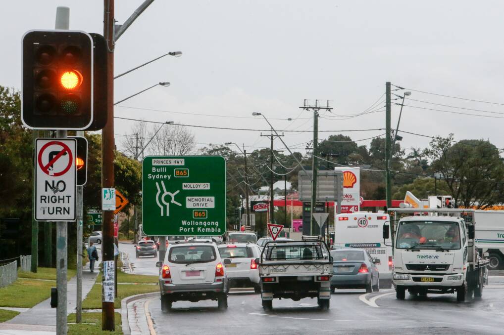 Drivers heading north along the Princes Highway at Bulli are breaking the law by not signalling a left turn at the Memorial Drive roundabout. Picture: Adam McLean
