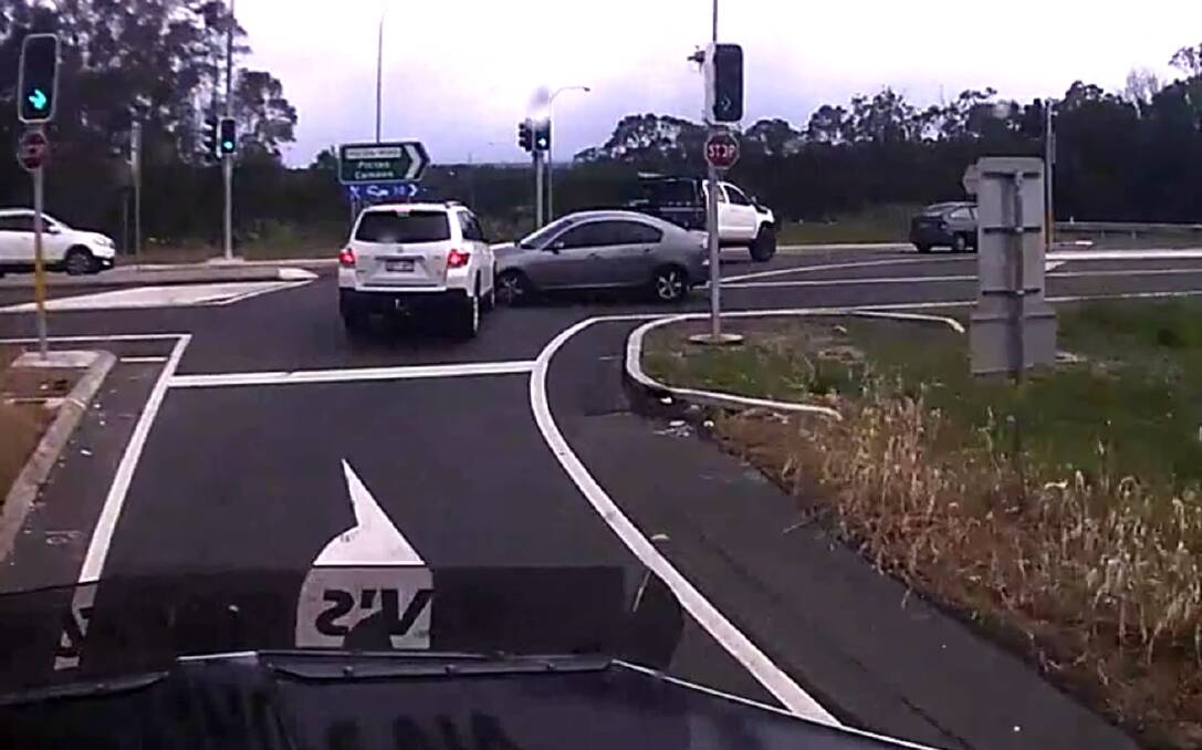 Dash cam footage showing a silver sedan ploughing into cars turning right at the Hume Motorway interchange on Picton Road. Picture: Dash Cam Owners Australia
