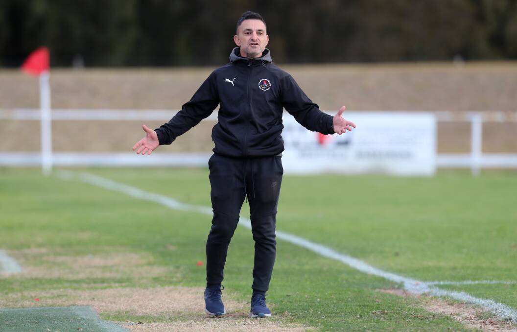 COMMITTED: George Antoniou is staying on as coach of the Wollongong Olympic men's premier league team next year. Picture: Sylvia Liber