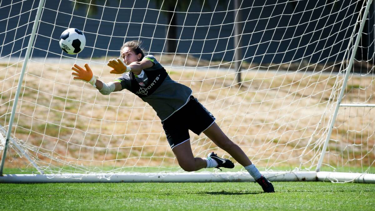 Trudy Burke prepares to stop the ball during her goalkeeping days at Canberra United in 2014. Picture: Elesa Kurtz