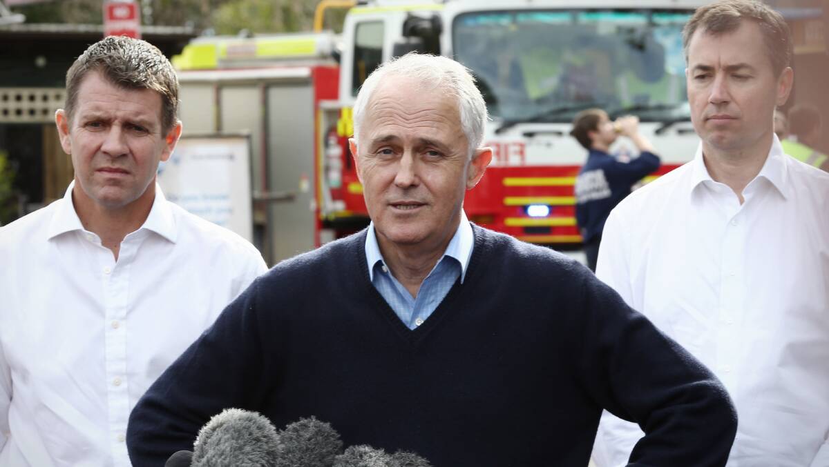 Relief: NSW Premeir Mike Baird and Prime Minister Malcolm Turnbull, in Picton on Tuesday, declared the Illawarra a natural disaster area. Photo: Andrew Meares