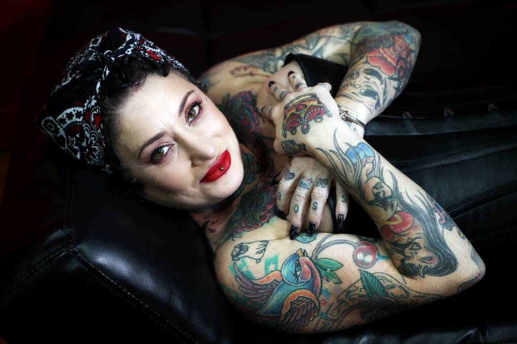 Deep love: Sue lives and breathes tattoos and loves helping others satisfy their cravings for body art. Watch her video at illawarramercury.com.au