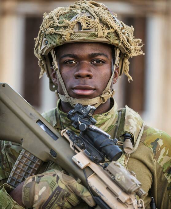 Model soldier: Congolese refugee Jean Marc Bukasa, once scared of soldiers, signed up to the Australian Defence Force. 