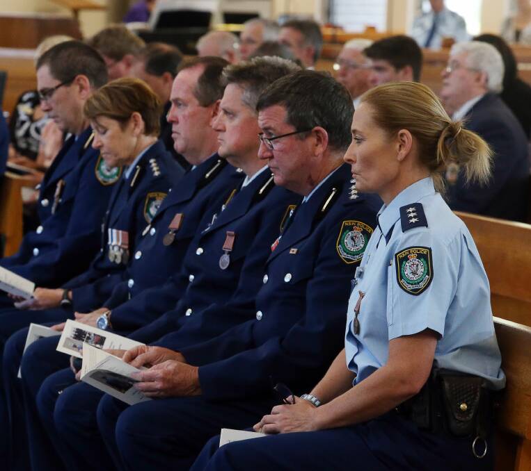 Respect: Lake Illawarra and Wollongong police remembering fallen colleagues at a service in Shellharbour. Picture: Robert Peet 