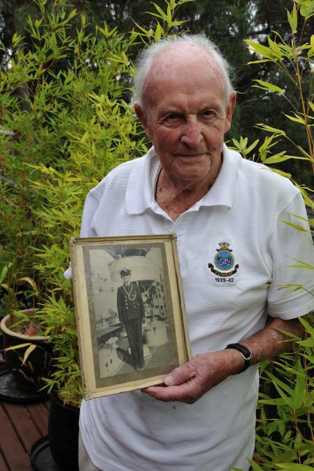 One of two: David Manning with a picture of himself in 1937 at the age of 13, as a naval cadet aboard HMAS Vampire. Mr Manning is one of two crew of the Perth still alive. Picture: Lachlan Bence.