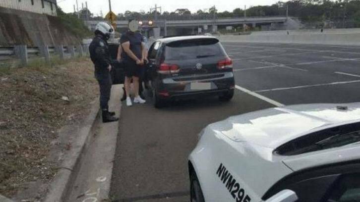 Police speak to a driver caught doing 199km/h in a 100 km/h zone in Beecroft on Christmas Eve. Photo: NSW Police