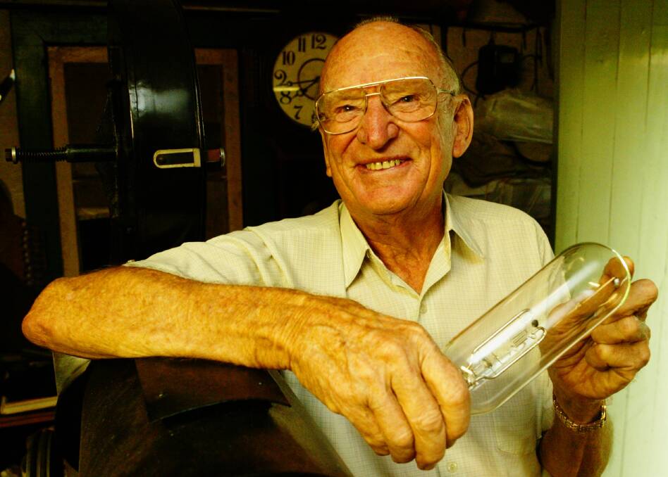 Eddie Vormister with a projector lamp from the film projector he made by hand. Picture Wayne Venables