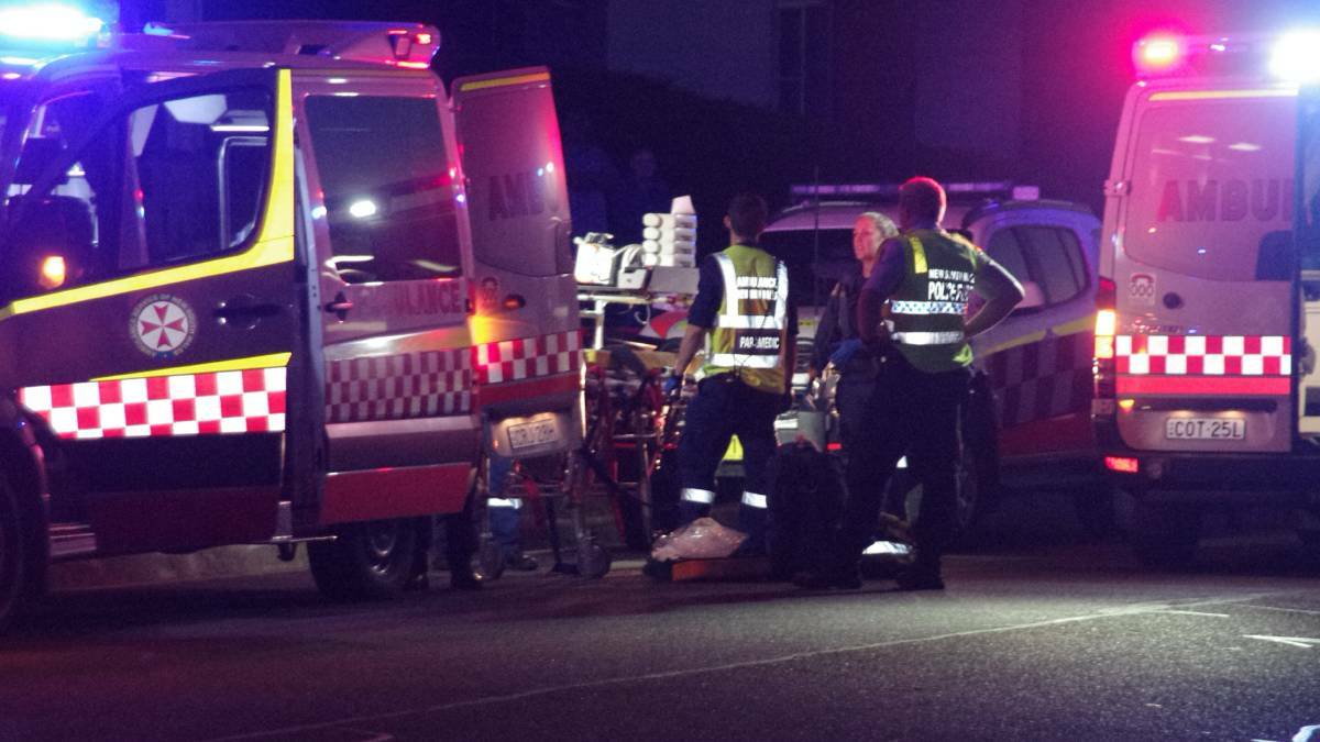 Police, NSW Ambulance paramedics and the Snowy Hydro Southcare doctor at the staging point on Gibson Street with at least one the patients from the incident in Crestwood, Goulburn on Christmas night. Photo: Darryl Fernance