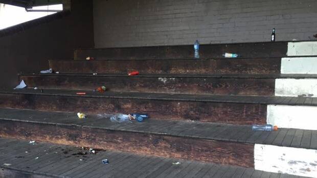 Cans and bottles strewn about the grandstand at Monash Park at Gladesville on Sunday. Photo: Lynda Ross
