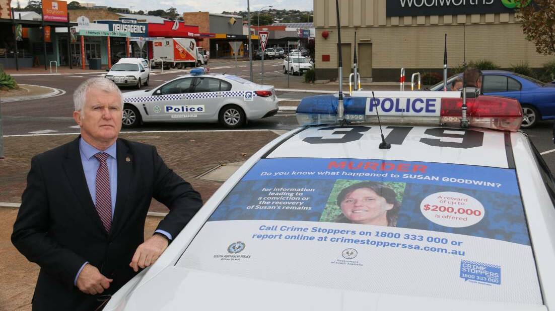 TASK FORCE LINCOLN: Detective Superintendent Des Bray with one of the police cars advertising the new campaign to help sold the cold case of Susan Gae Goodwin.
