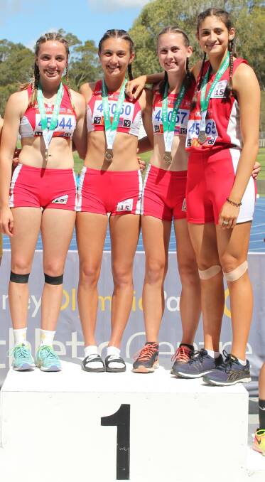 Victors: The gold medal winning under 15 girls 4x100m relay team. Picture: Tim Crinnion.
