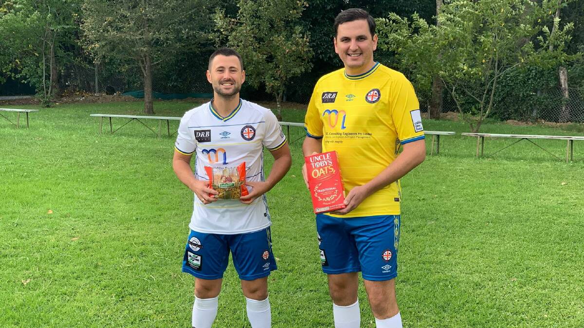 Food drive: Albion Park City FC players Dragan Balaban and Marko Cubrilovic with non-perishable food that will be donated to charity. 