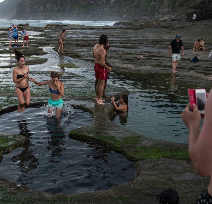 Pretty dangerous: Tourists are drawn to the picturesque pools to pose for photographs. Picture: Wolter Peeters.

