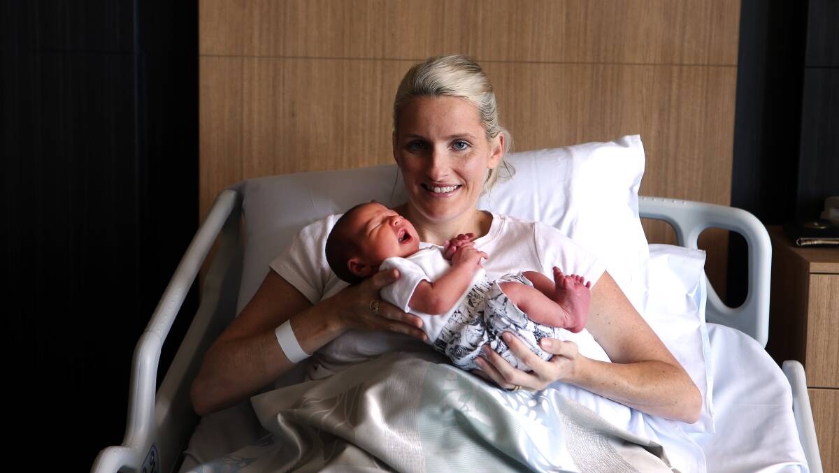 Figtree Private Hospital nurse Karina Murphy with four-day-old Elle who was among the last babies born at the old hospital. Pictures: Sylvia Liber